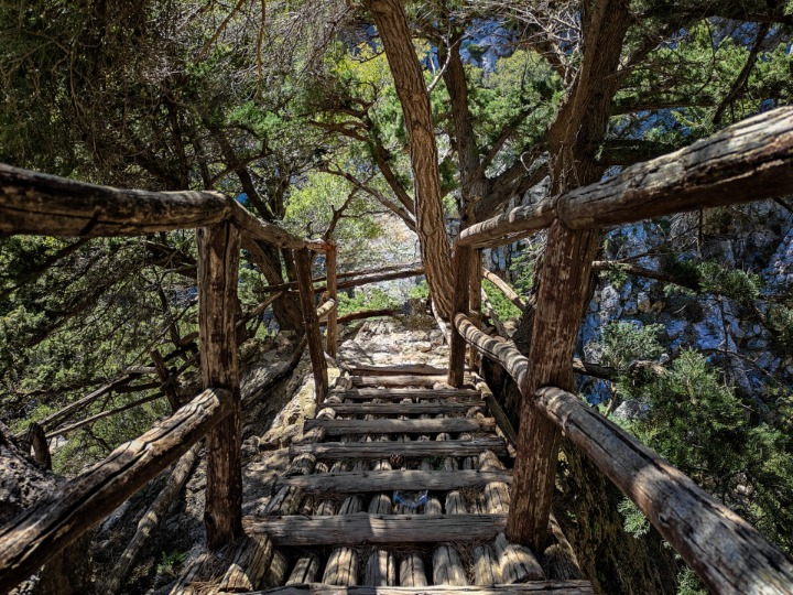 "Wooden bridge in the nature following the E4 path in Rouvas Gorge."