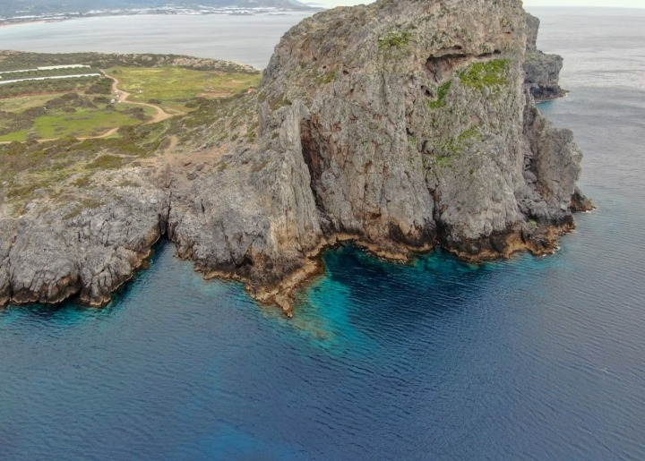 The hill where the acropolis of the Ancient Falassarna was uncovered overseeing the entirety of the harbor