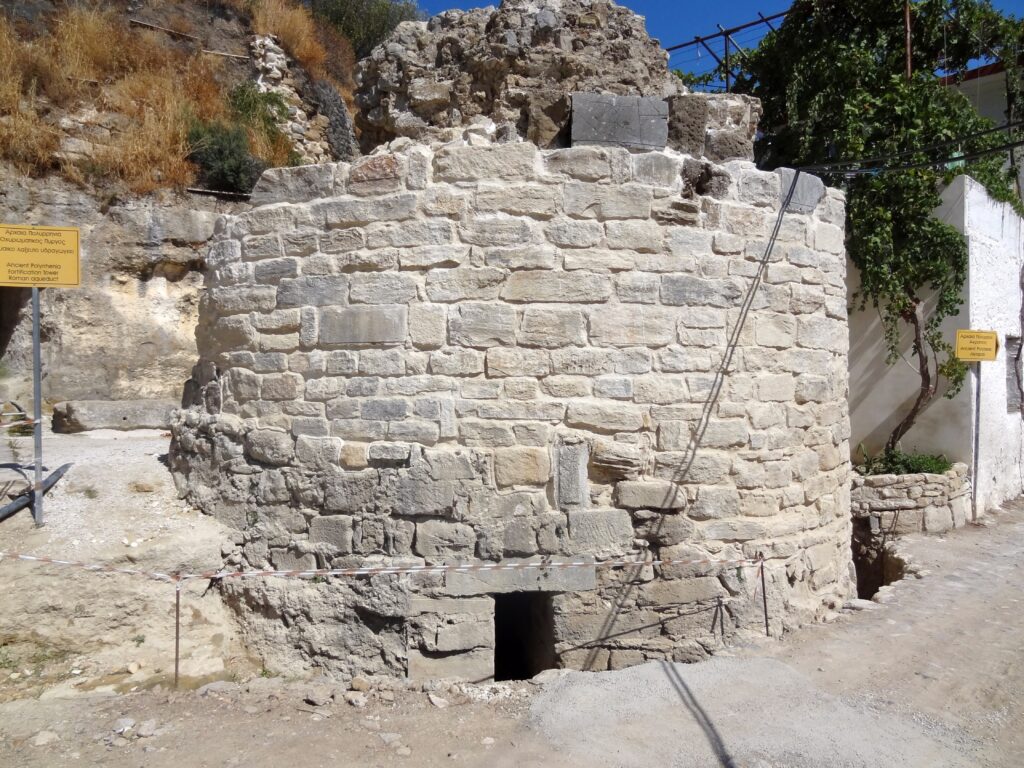 A restored semi-circular defensive tower in Polyrinia village