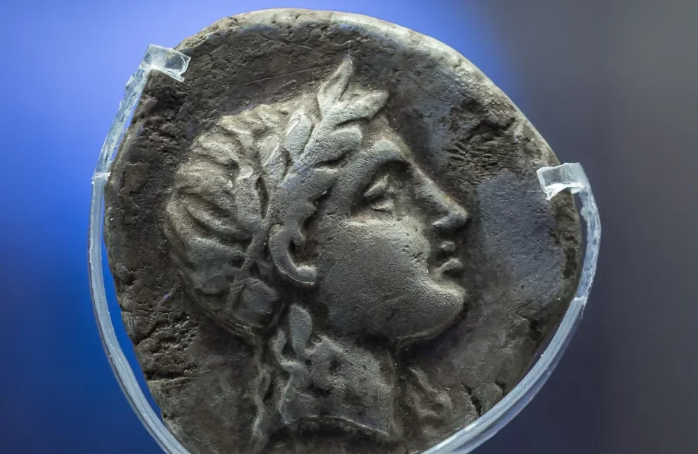 Ancient Eleutherna: Silver coin from Ancient Eleutherna picturing the head of Apollo