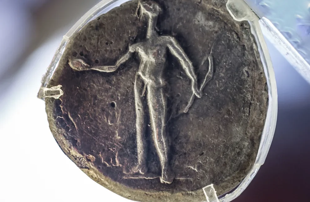 Ancient Eleutherna: Silver coin from Ancient Eleutherna picturing Apollo with a bow