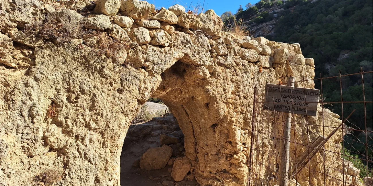 Mili Gorge: The arch marking the Kato MIli Neighborhood